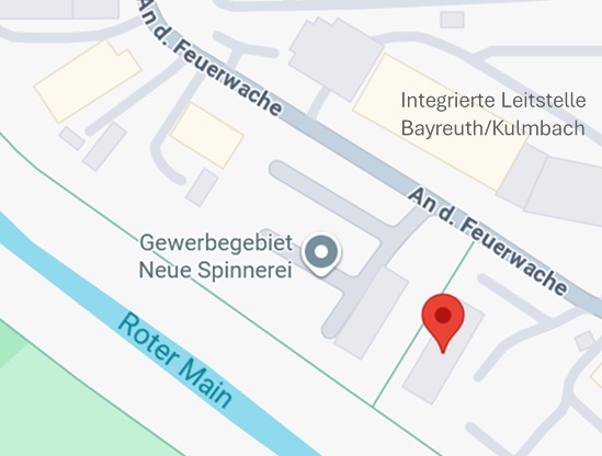 Map view with a red location pin along a street near the Roter Main canal in the Gewerbegebiet area.